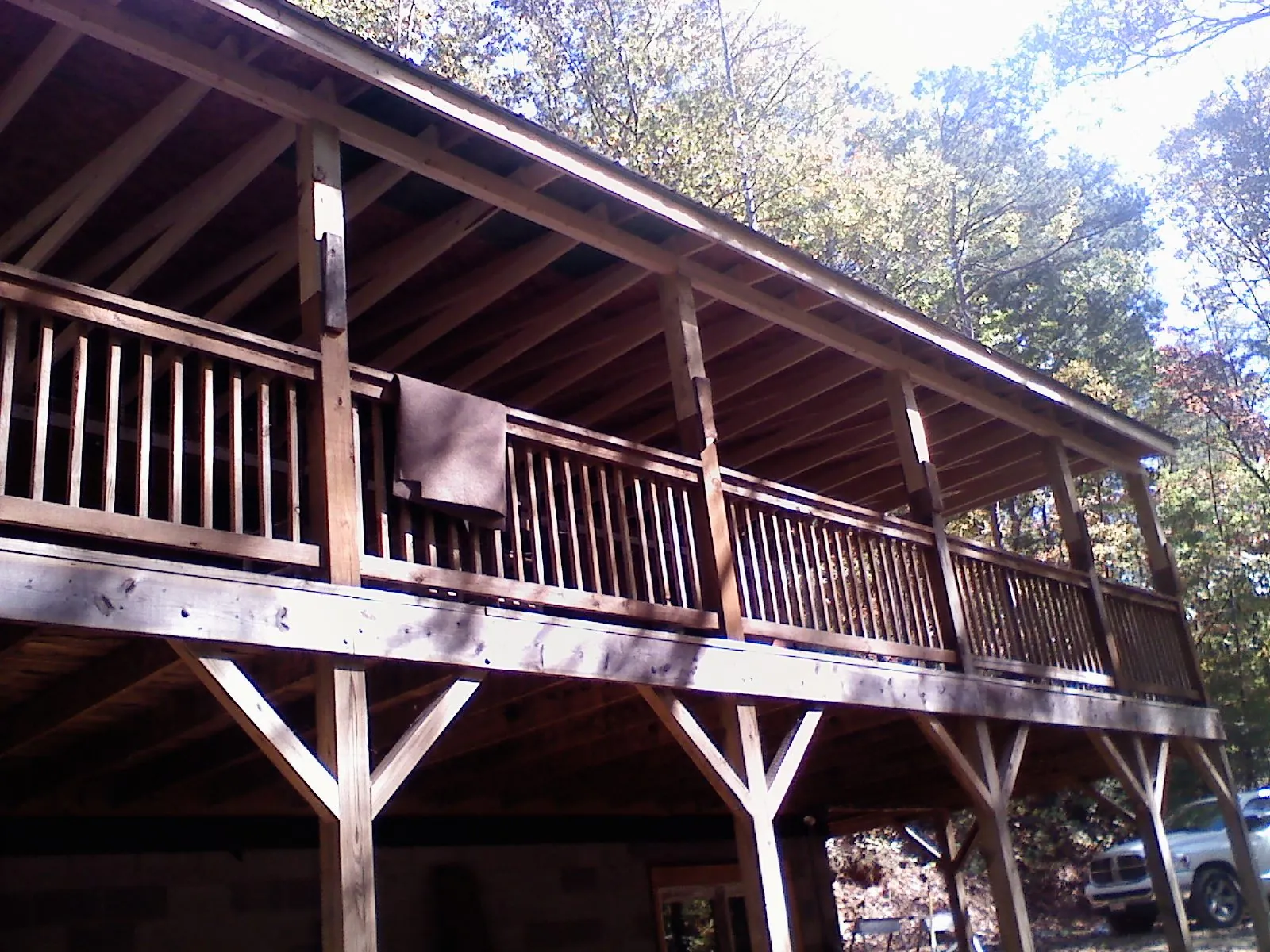 Timber framing under a new elevated porch and deck — Roof Leak Repair in West Olive by Roofing Brothers